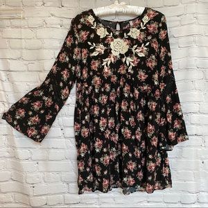 Black and floral embroidered babydoll dress with bell sleeves